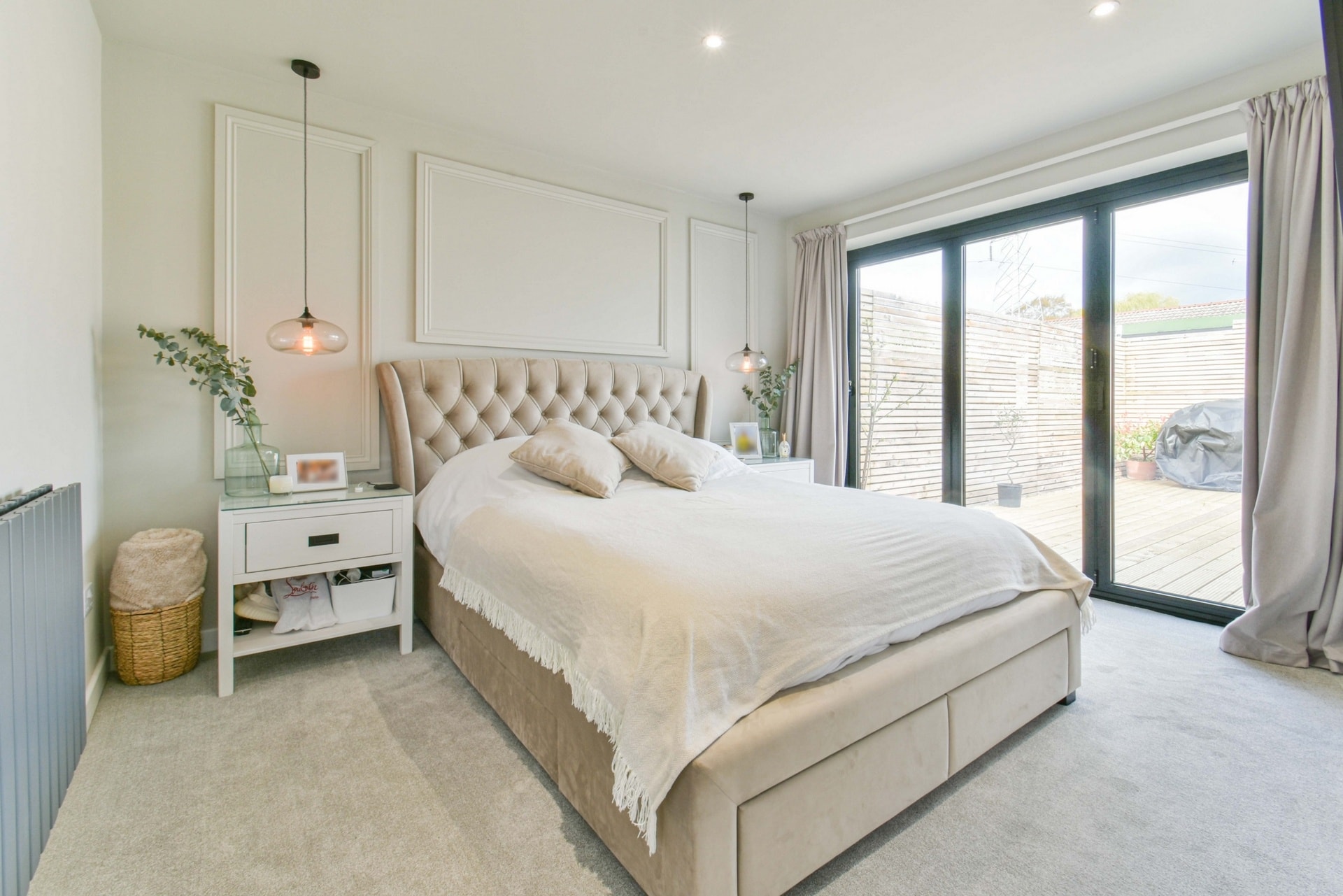 Bedroom One with neutral colour scheme and king size bed in the room.